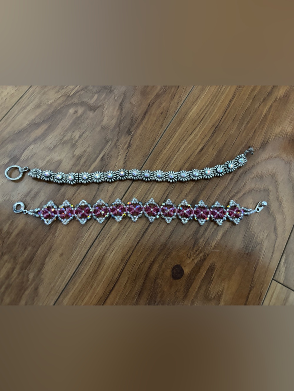 Silver Daisy Bracelet and Pink Crystal Lace Bracelet. Both included.